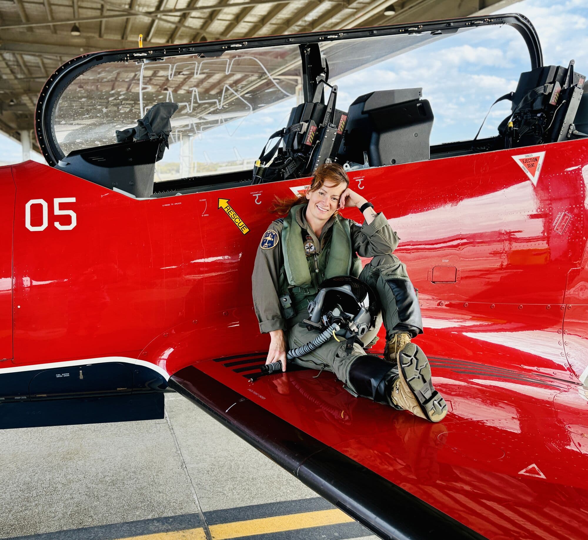 Steffanie Smith on the wing of a PC-21 trainer
