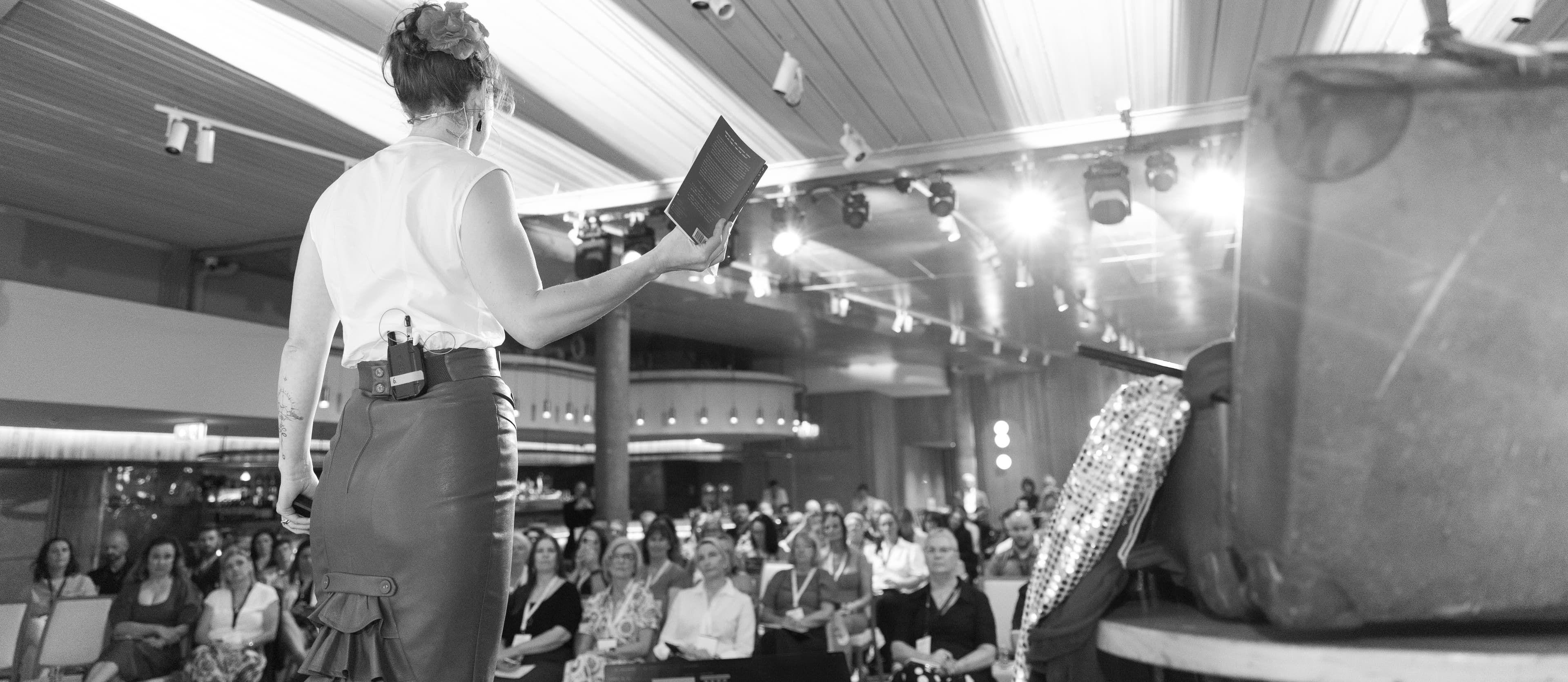 A speaker addressing a conference audience